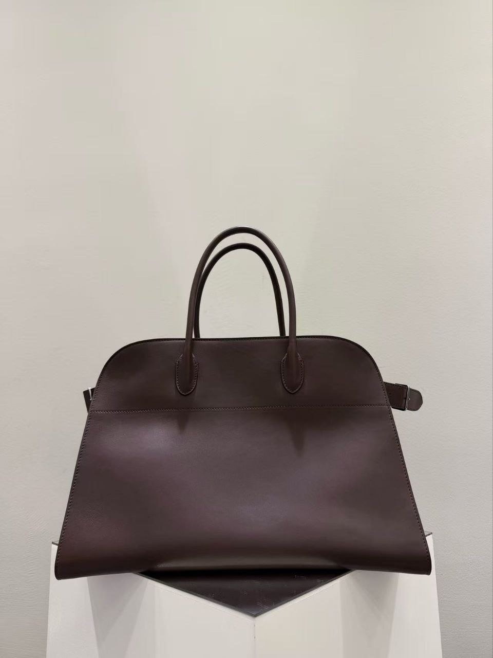 The Row Margaux 17 shoulder bag in premium Masoni leather, coffee color.