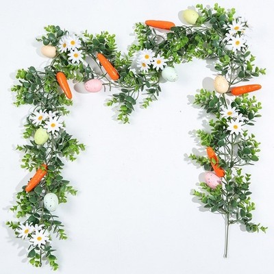 Ostern Frühlingsdeko: Weinrebe imitat mit Karotteneiern für Innenwandaufstelle