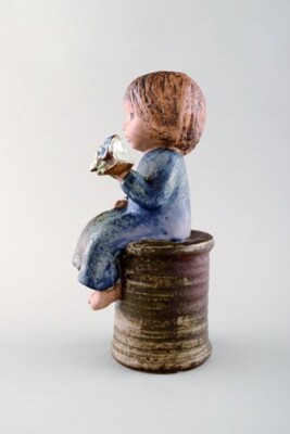 Lisa Larson for Gustavsberg. Girl with flowers in glazed ceramics