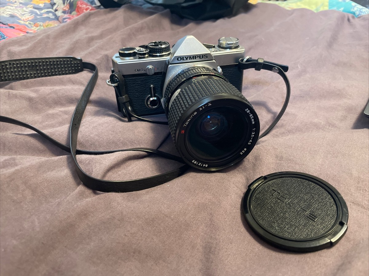 Olympus OM-2N SLR camera w/ lens tokina AT-X 28-85mm 1:3.5