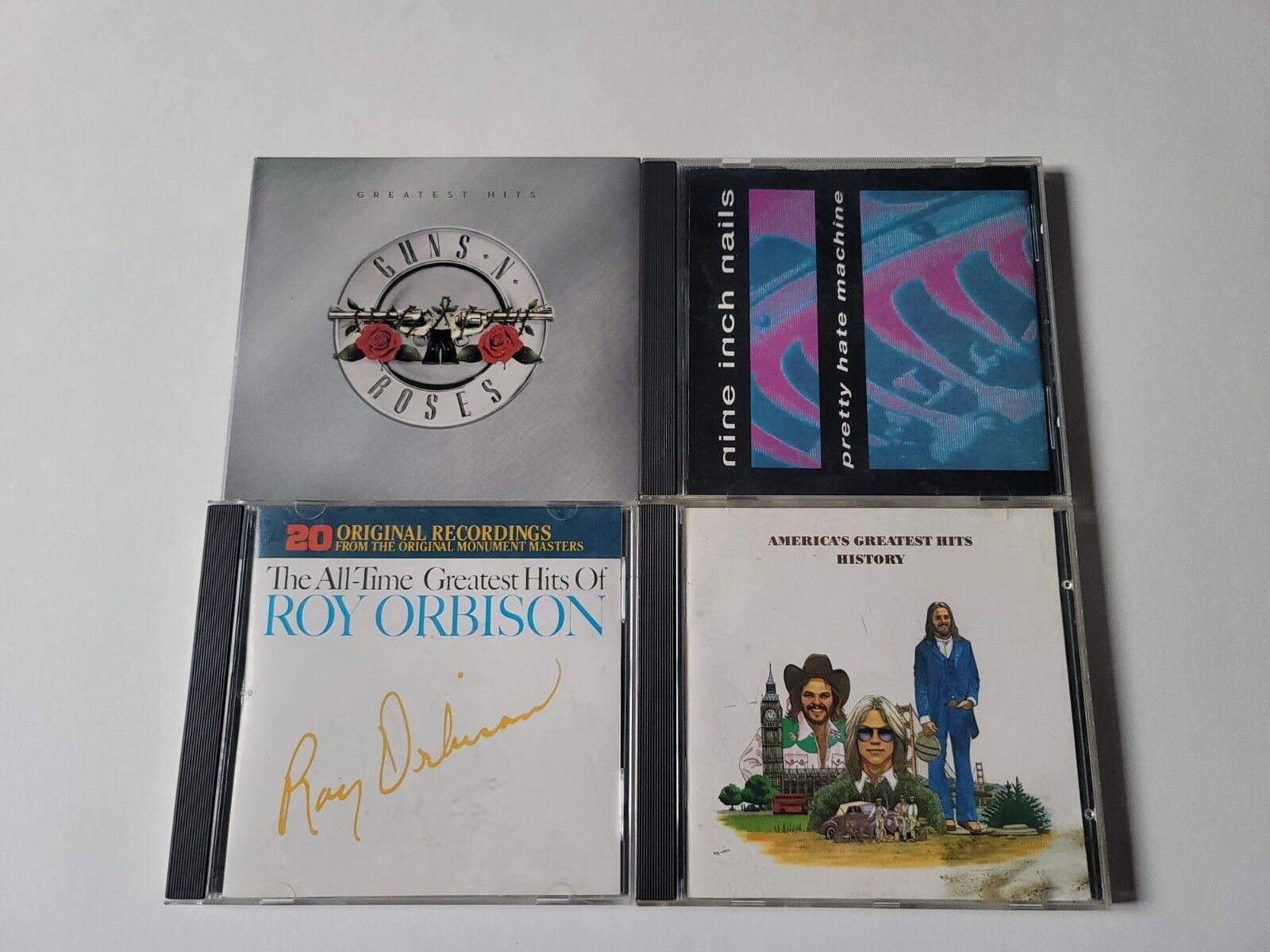 Rock CD Lot of 4 Guns and Roses, Nine Inch Nails, Roy Orbison, Americas Greatest