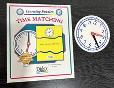 Didax Basic Skills Puzzles Telling Time; 27 self matching cards; 81 Pieces