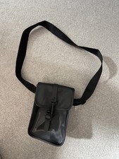 Rains Flight Bag is a sleek, waterproof crossbody bag adjustable straps/hardware