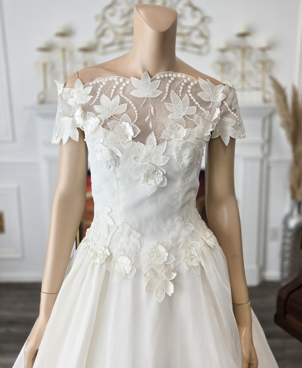 vintage floral organza wedding dress Meet the Emma gown. This classic A-line tulle gown features a modern organza and sparkle floral, perfect for any wedding aesthetic. Book and appt with the link our bio to try on