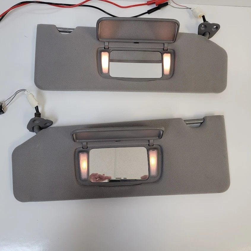 Par de parasoles gris tela con luces de espejo OEM Toyota Avalon 2002-2004 Foto 2 de 4