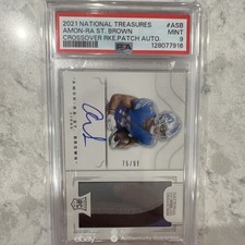 2021 National Treasures Amon-Ra St. Brown Crossover Rookie Patch Auto75/99 PSA 9