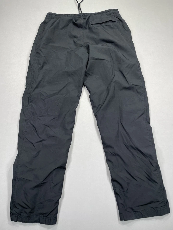 Pantalones cortavientos Nike de colección para hombre M pantalón de pista bolsillo negro atlético naranja etiqueta Foto 3 de 4