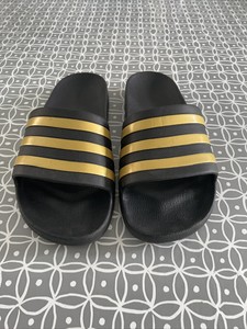 adidas black and gold sliders