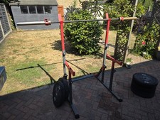 Squat Rack + 20kg Olympic Bar and 105 Kg Weights