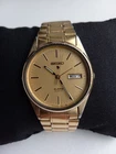Seiko alarm quartz watch, vintage with day/date display, gold tone, 5C23-8009