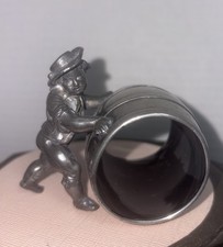 Meriden B Co. Figural Napkin Ring, Boy In Straw Hat Pushing A Barrel, #171.