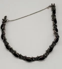 VINTAGE STERLING SILVER MARCASITE AND ONYX BRACELET