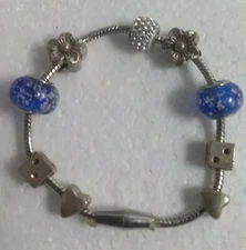 Swarvoski MULA Pandora ? Silver Toned Bracelet With 9 Charms Magnetic  Closure