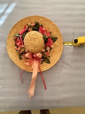 Straw hat with pink flowers and pink ribbons