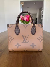 Louis Vuitton on the go reverse monogram bag PM no strap, with dust bag