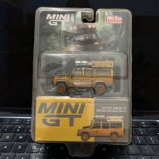 Mini GT #221 Land Rover Defender 110 1989 Camel Trophy Winner UK (Dirty) Blister