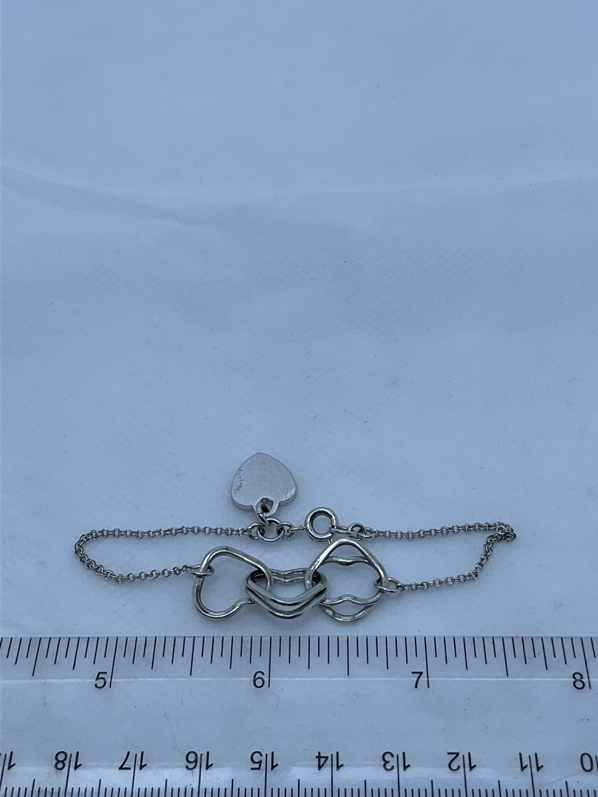 Juicy Couture Silvertone Interlocking Hearts Brac… - image 3