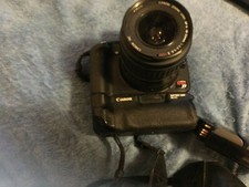 Canon Rebel xt with canon lens 18-55 ef-s 58mm battery grip bd-e3 2 batteries no