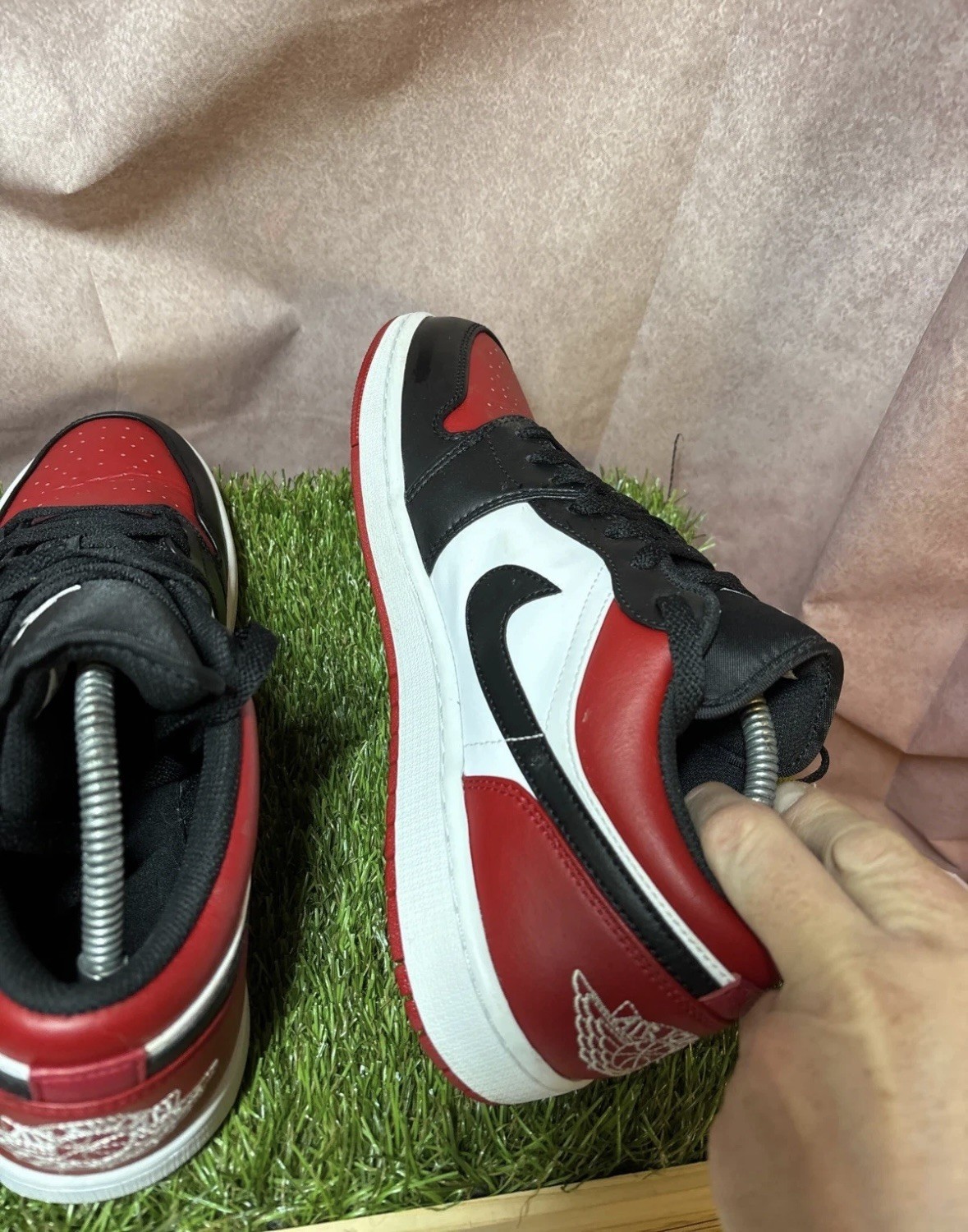 Nike Air Jordan 1 Low Bred Toe Mens Trainers in a black, red, and white image 7