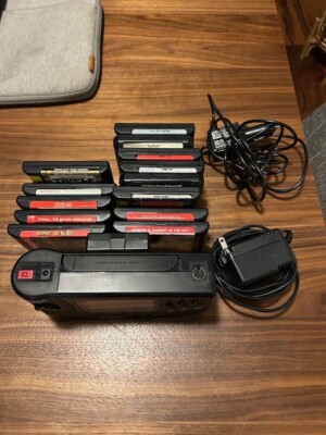 Sega Nomad Handheld Console with battery pack and AC adapter, 13 games