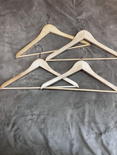 Set of Four Light Color Wood Hangers Height 9" and Width 17"