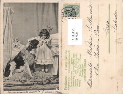 487324,Mädchen Kind m. Hund m. Hut Puppe im Hintergrund