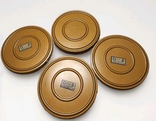 A group of 4- four Dual 8 metal movie 200' reels and cans as shown.