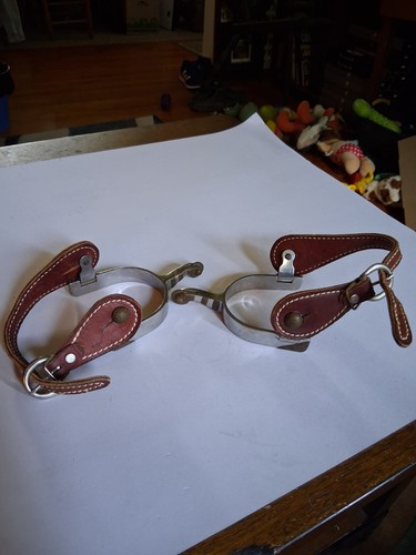 Spurs Metal Frame And Leather Straps Pair