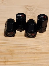 4 X WHEEL TIRE VALVE STEM CAPS -BLACK ON BLACK - HEXAGON-FOR AT4 GMC
