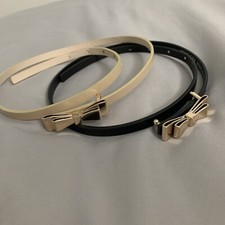 BLACK AND CREAM BELTS WITH BOW BUCKLE--SOLD TOGETHER--GREAT CONDITION
