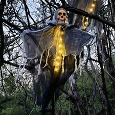 Luminous skeleton skull made of gauze to hang for Halloween.