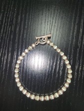 beaded bracelet with grey/green cats eye beads and sterling silver toggle clasp
