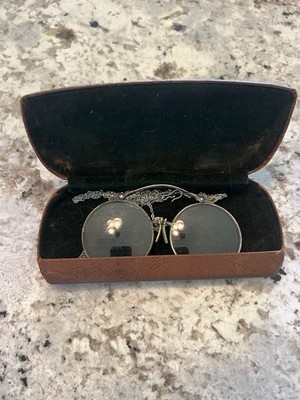 antique vintage eyeglasses, likely pince-nez or lorgnette, housed in its origina