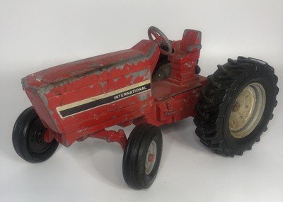 red metal tractor toy