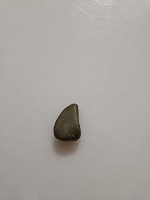 a type of polished or worked stone, potentially a celt or a similar stone tool