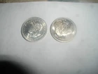 TWO (2) ONE OUNCE SILVER COINS:JOHNSON MATHEY,1986;SILVER TRADE UNIT 1984,.999