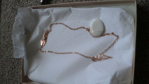 Lola Rose white stone necklace on rose 