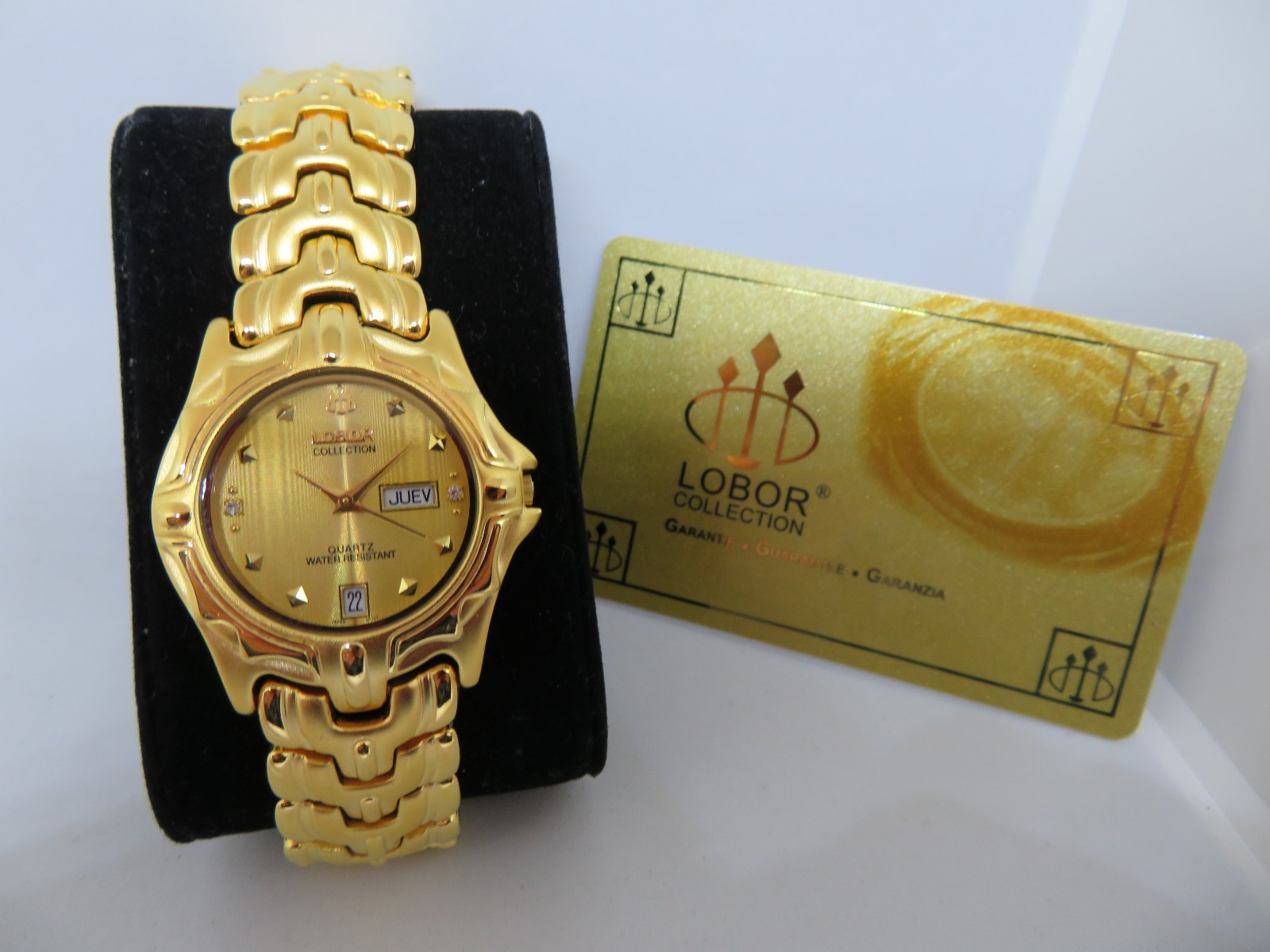 Montre Lobor plaquée or avec 2 pierres Swarovski et calendrier complet jour date cadran doré