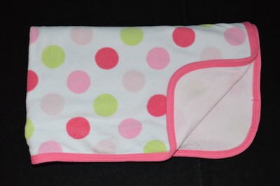 pink blanket with white polka dots