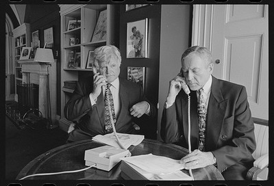 Senators Ted Kennedy Orrin Hatch, seated table, talking telephones, Washington,