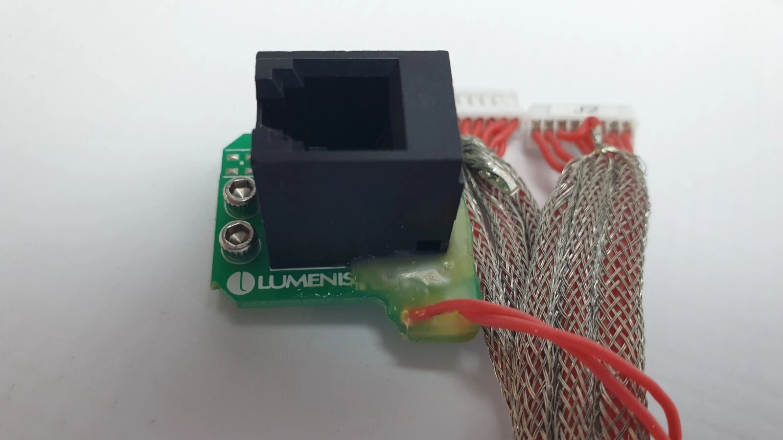 Black RJ-style modular jack on the Lumenis board of the Galvo scanner harness