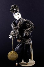 Show Stoppers Collectible Porcelain Doll, 11" tall on stand.