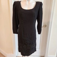Montaldo's Carolina Herrera vintage black dress with bead on the bottom size 6
