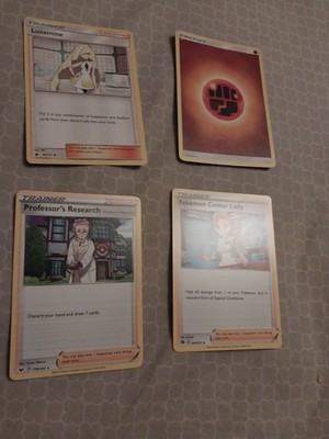 4 pokemon cards- lusamine, orange energy, pokemon center lady, professor's resea
