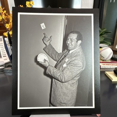 Black & White Photograph of Magician Performing Card Trick, Ace of Clubs Visible