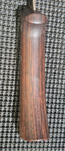 Vintage WESTERN fish fillet knife with dark wood handle, red and black stripes, USA made, shown beside a textured sheath.