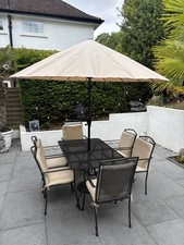 Garden table and chairs plus umbrella