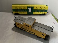 Listed are 2 Bachmann HO Train Cars, A Pine Sol liquid Car  a Cheesie Caboose