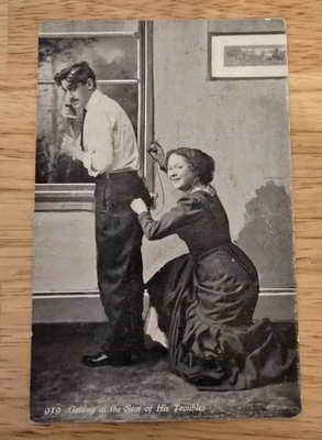 #ad Vintage 1911 Photo Postcard Woman Sews Husbands Pants While Wearing Them $11.75