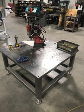Industrial Metal Welding table has legs and adjustable leveling feet
